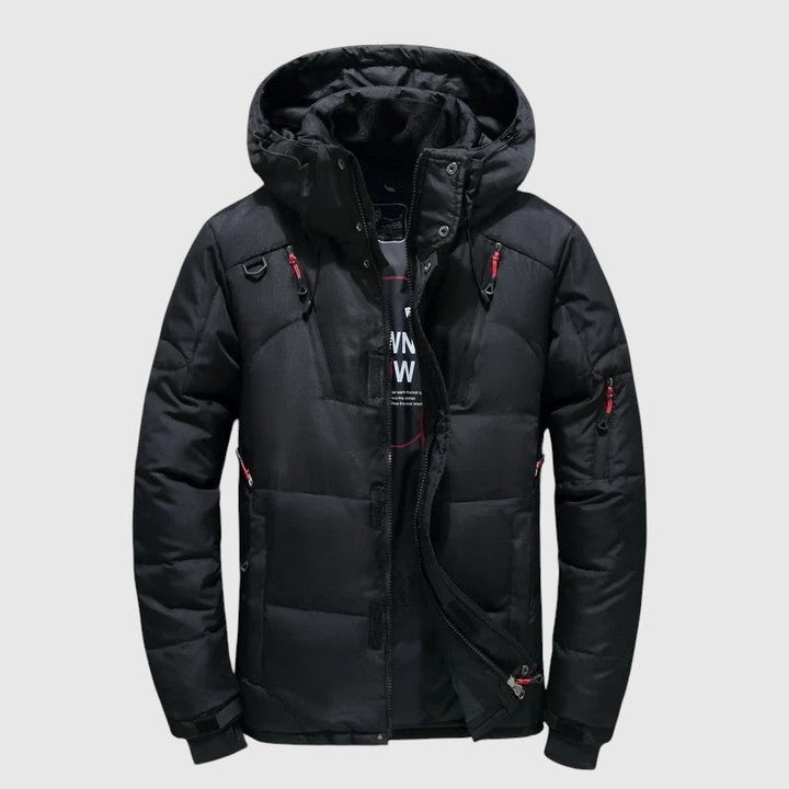 André – Pufasta jakna s kapuljačom i tehničkim detaljima